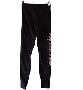 Piece Apparel black leggings with white words up leg